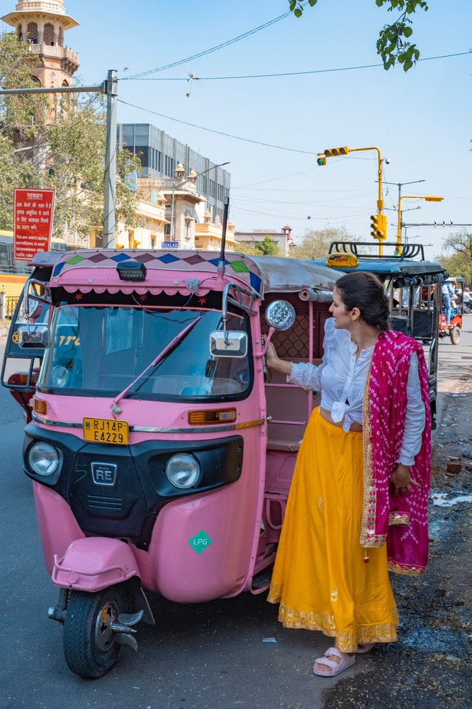 Pink Rickshaw, Jaipur Girl stepping out of Pink Rickshaw, Jaipur, The Pink City, Adriana Neptuna Wanderlicious